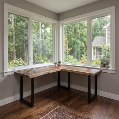 L-shaped solid wood corner desk in a bright bay-window home office workspace