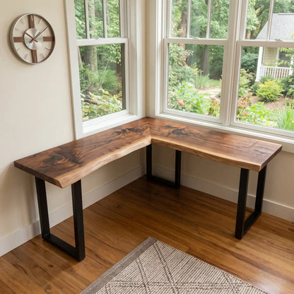 L-shaped solid wood corner office desk positioned by large windows in a bright room