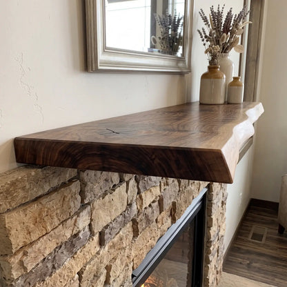 Close-up side view of a solid wood live edge fireplace mantel showing the thick wood profile and natural edge