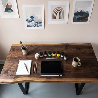 Top view of live edge computer desk with monitor, keyboard and office accessories