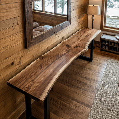 Angled top view of solid wood live edge console table in walnut color finish against rustic wood wall